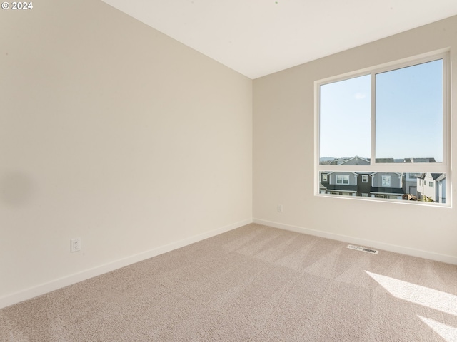 view of carpeted spare room