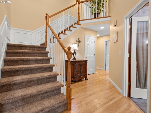 stairway featuring hardwood / wood-style flooring