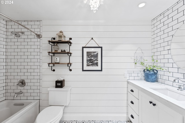 full bathroom with tiled shower / bath, toilet, and vanity