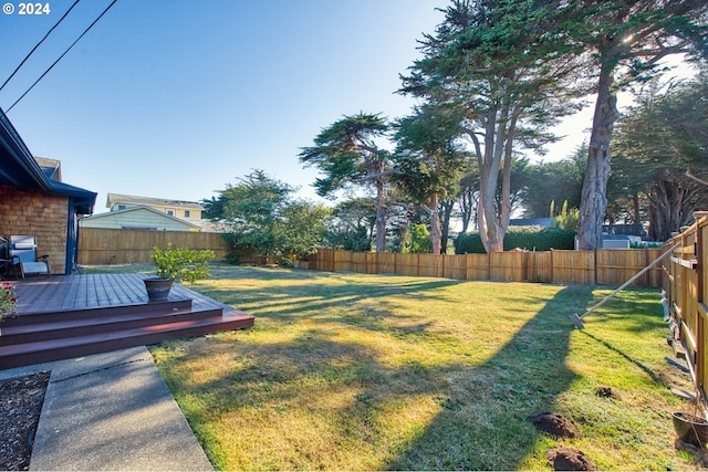 view of yard featuring a wooden deck