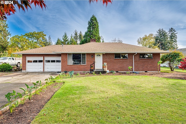 single story home with a garage and a front lawn