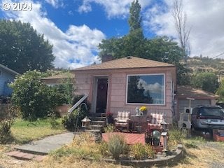 3214 W 10th St, The Dalles, OR 97058 - bungalow with entry steps and an attached garage