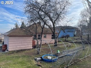 3214 W 10th St, The Dalles, OR 97058 - back of house with an attached garage