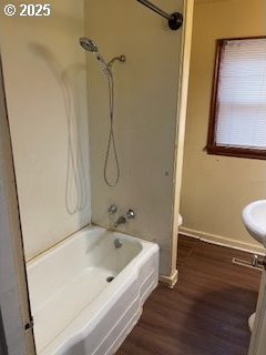 3214 W 10th St, The Dalles, OR 97058 - full bath featuring  shower combination, baseboards, toilet, and wood finished floors