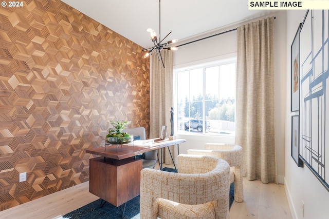 home office featuring a notable chandelier and hardwood / wood-style flooring