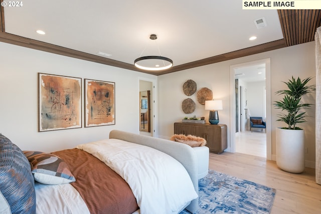 bedroom featuring recessed lighting, visible vents, light wood-style floors, and ornamental molding