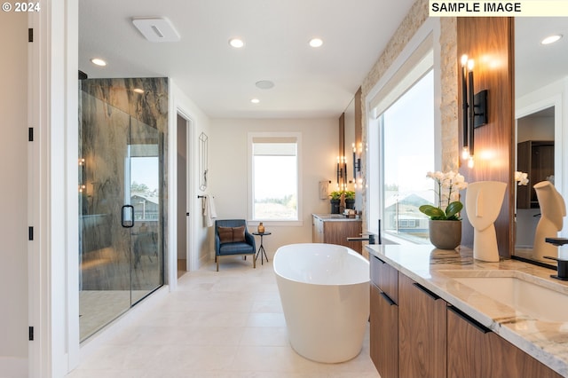 full bath with recessed lighting, a soaking tub, a stall shower, and vanity