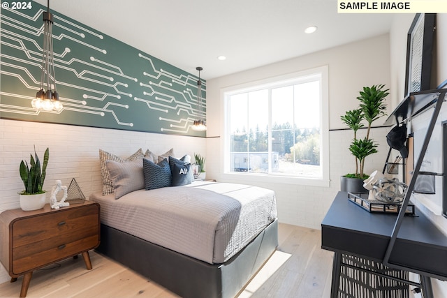 bedroom featuring recessed lighting and wood finished floors