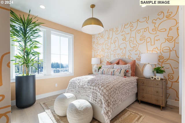 bedroom with recessed lighting, baseboards, and light wood-type flooring