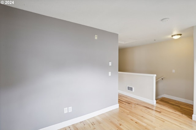 spare room with hardwood / wood-style flooring