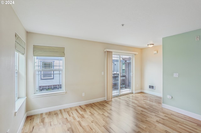 unfurnished room featuring light wood-type flooring