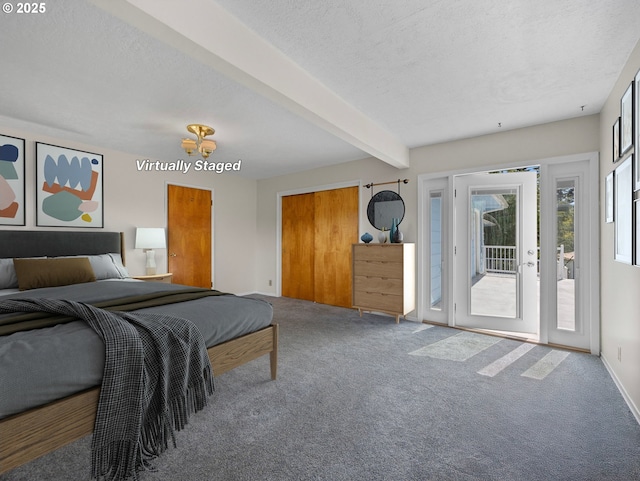 carpeted bedroom featuring access to outside, beam ceiling, and a textured ceiling