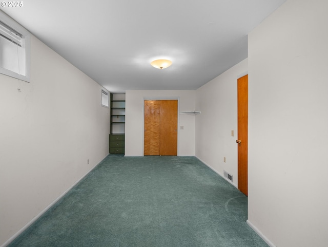 unfurnished bedroom with carpet and a closet
