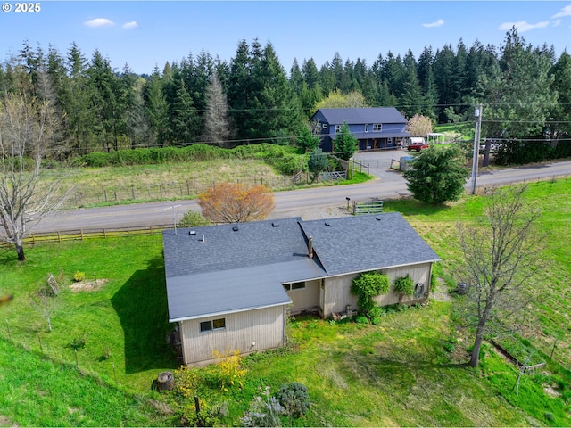view from above of property with a forest