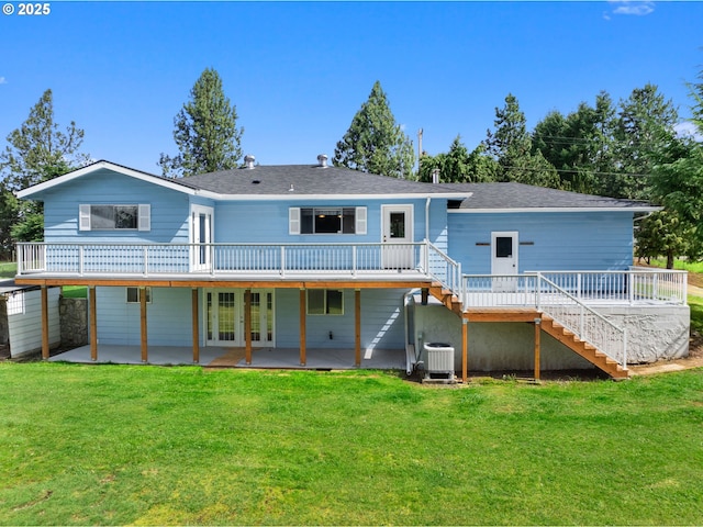 back of house with a patio area, french doors, stairs, a deck, and a lawn