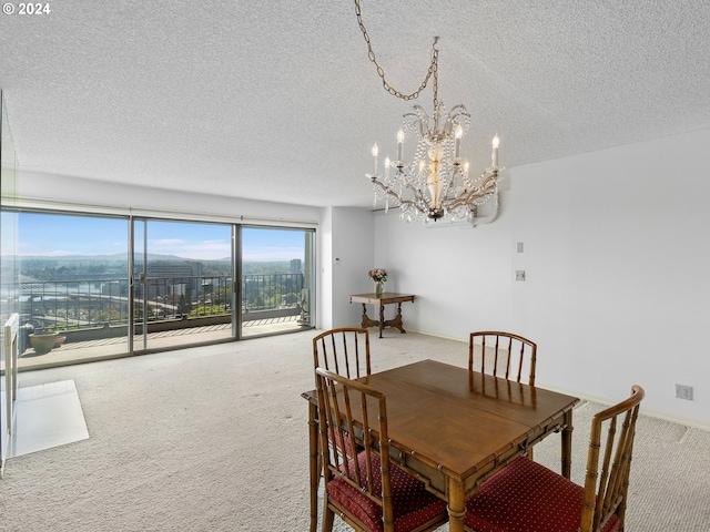 carpeted dining area with baseboards and a textured ceiling