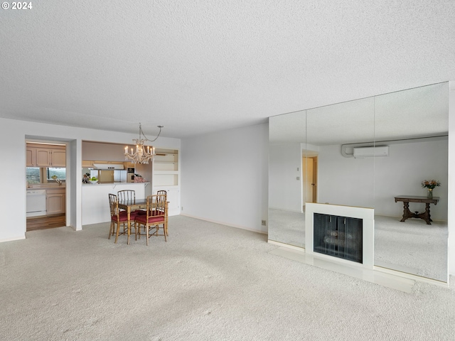 living room featuring a wall mounted AC, a fireplace with flush hearth, carpet flooring, a textured ceiling, and a chandelier