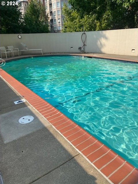 view of pool with fence and a fenced in pool