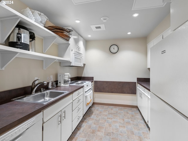 kitchen featuring white appliances, visible vents, dark countertops, open shelves, and a sink