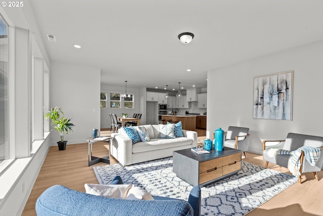 living room with light hardwood / wood-style flooring