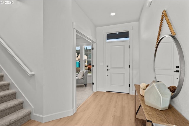 foyer entrance with light wood-type flooring