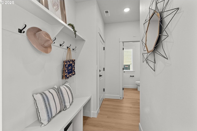 mudroom with light hardwood / wood-style floors