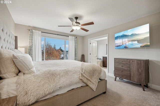 carpeted bedroom featuring ceiling fan and connected bathroom