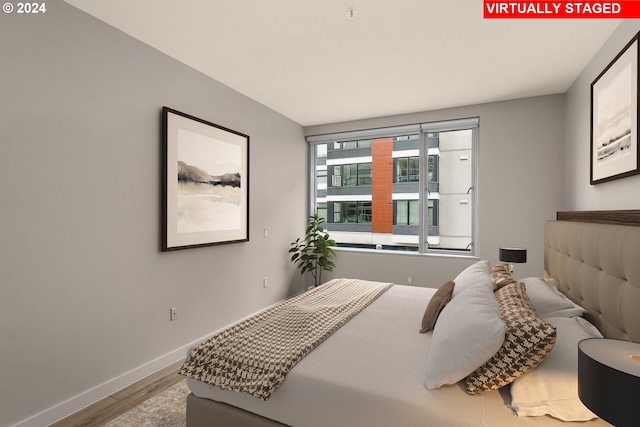 bedroom featuring hardwood / wood-style flooring