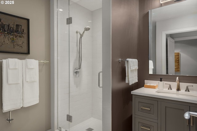 bathroom featuring a stall shower and vanity