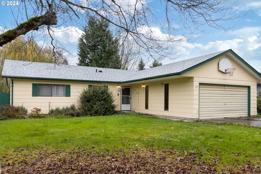 single story home with a garage and a front yard