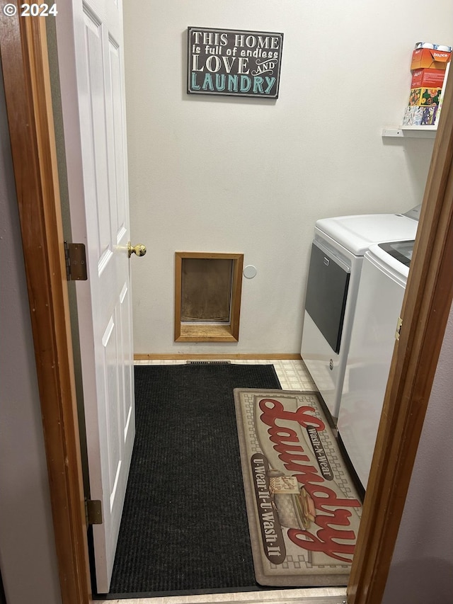 laundry room featuring carpet flooring and washing machine and clothes dryer