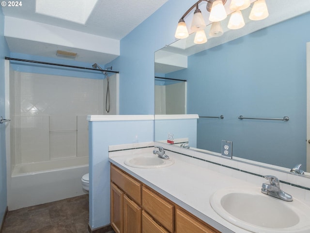 full bathroom featuring washtub / shower combination, a textured ceiling, vanity, and toilet