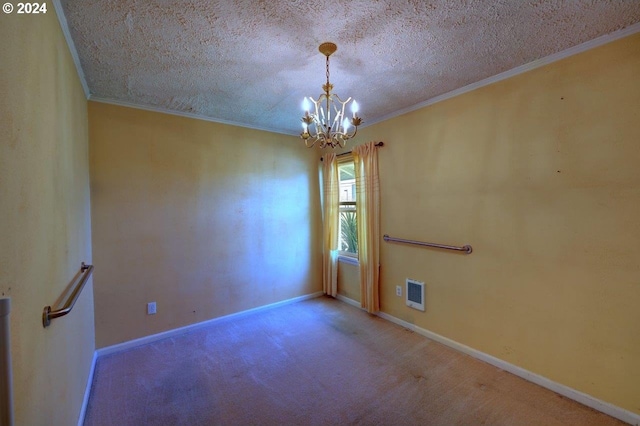 carpeted empty room featuring a textured ceiling, ornamental molding, and an inviting chandelier