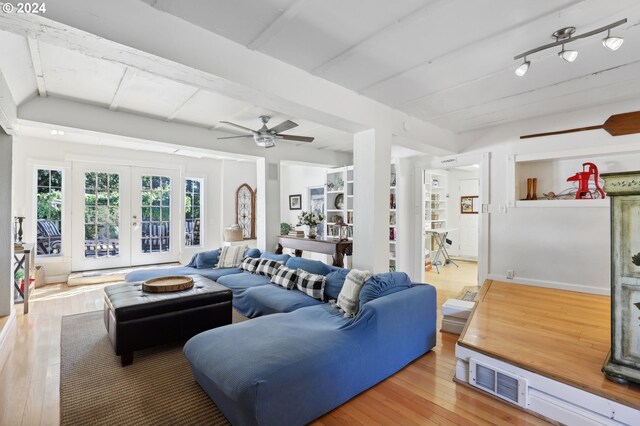 living room with ceiling fan, wood-type flooring, and french doors