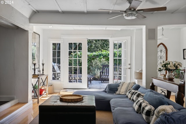 living room featuring hardwood / wood-style flooring and ceiling fan