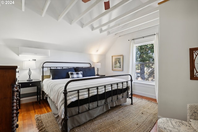 bedroom with lofted ceiling with beams, hardwood / wood-style floors, ceiling fan, and a wall mounted air conditioner