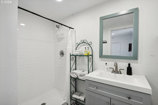 bathroom featuring vanity and a shower with shower curtain