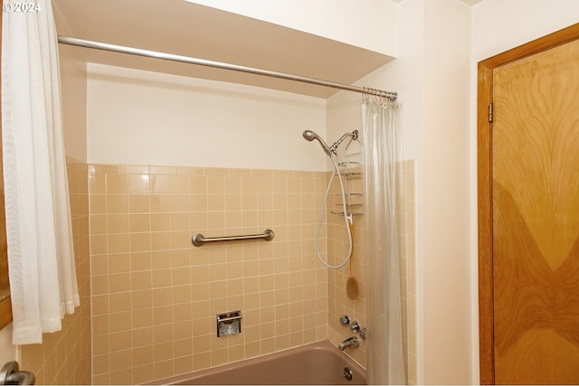 bathroom featuring shower / bathtub combination with curtain