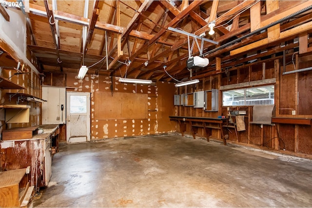 garage featuring a workshop area and a garage door opener