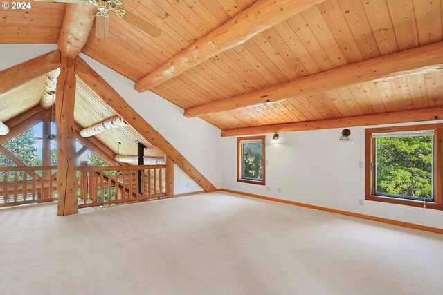 spare room with wooden ceiling, plenty of natural light, and light colored carpet