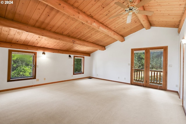 carpeted empty room featuring lofted ceiling with beams, wooden ceiling, a ceiling fan, and baseboards