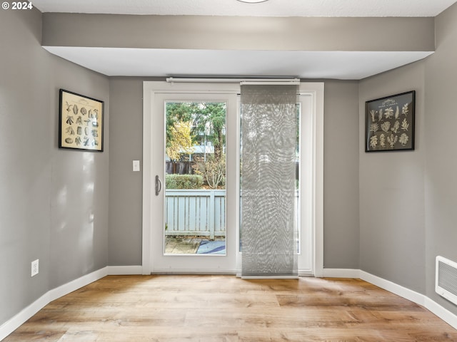 doorway to outside featuring light hardwood / wood-style floors