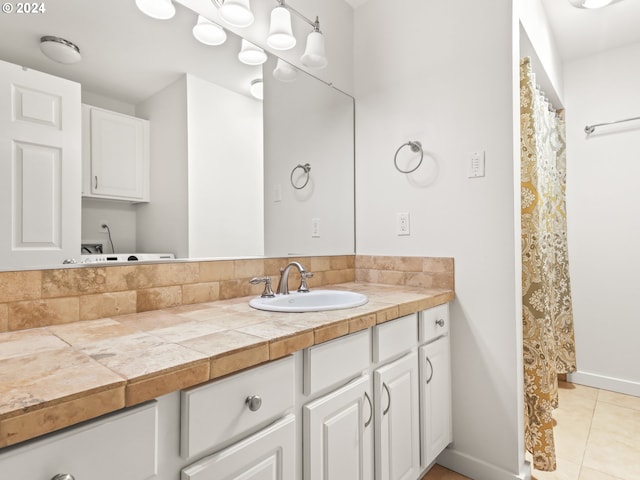 bathroom with tile patterned floors and vanity