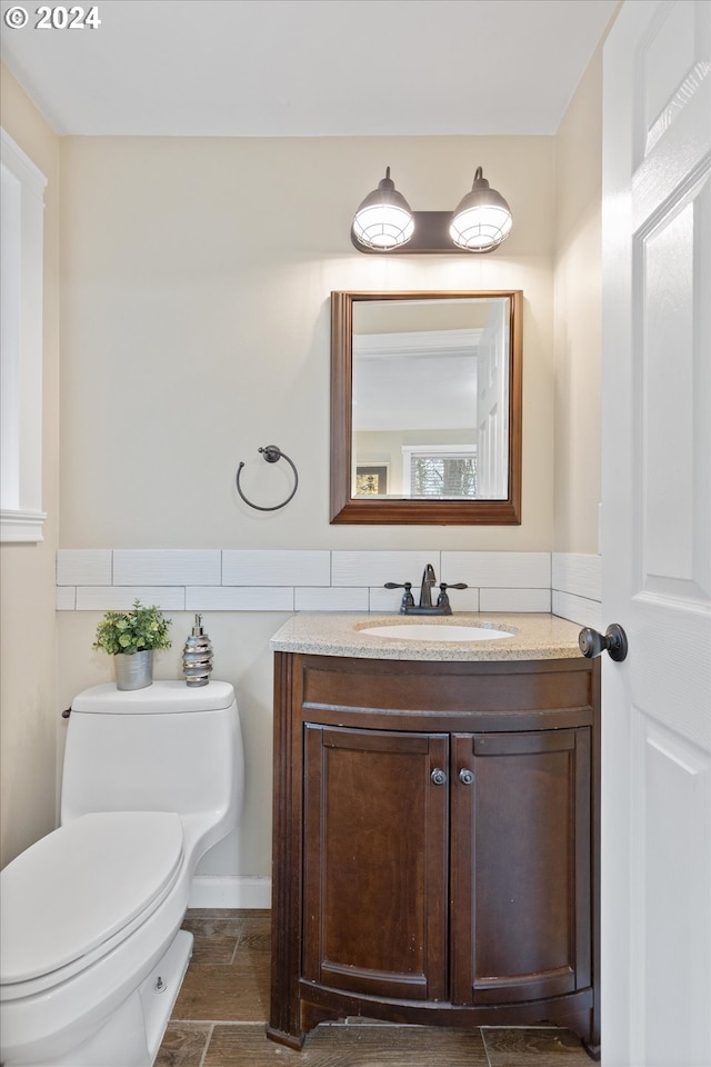 bathroom with vanity and toilet