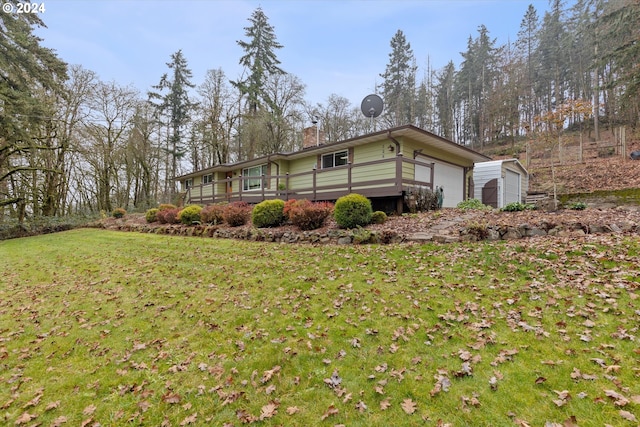 view of side of property with a lawn