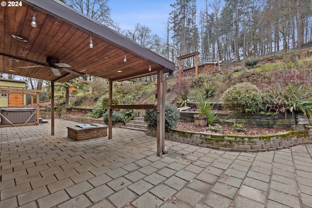 view of patio with a hot tub and ceiling fan