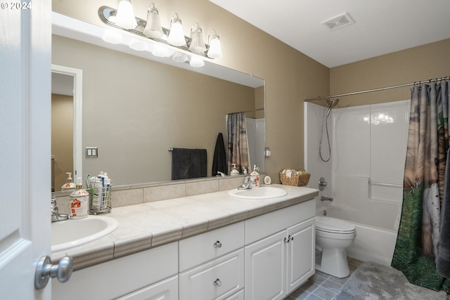 full bathroom with tile patterned floors, vanity, toilet, and shower / tub combo