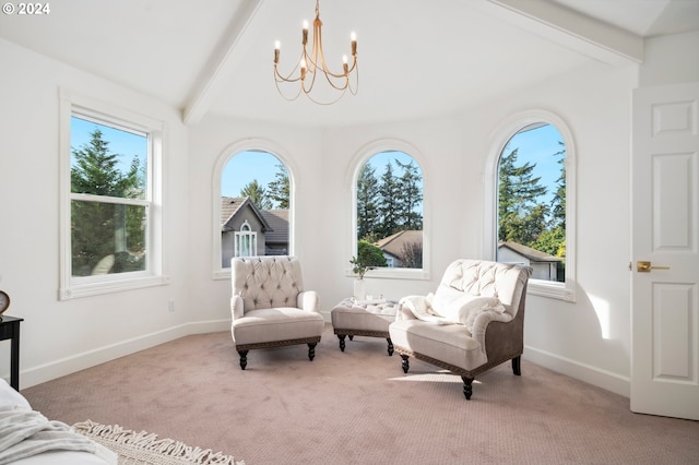 sitting room featuring light colored carpet, a chandelier, lofted ceiling with beams, and a healthy amount of sunlight