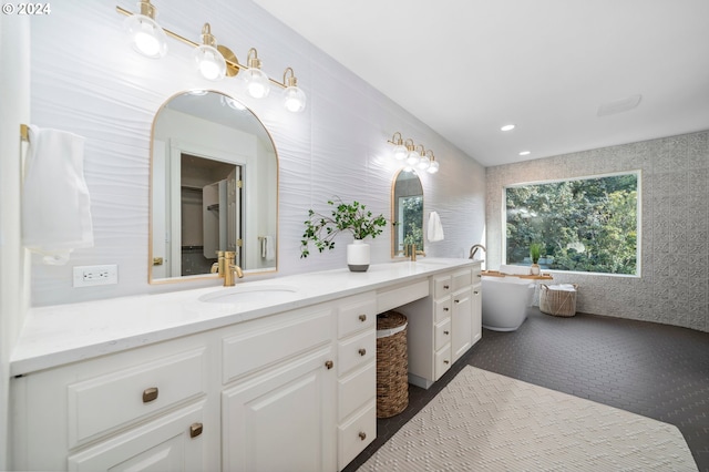 bathroom with a bathtub and vanity