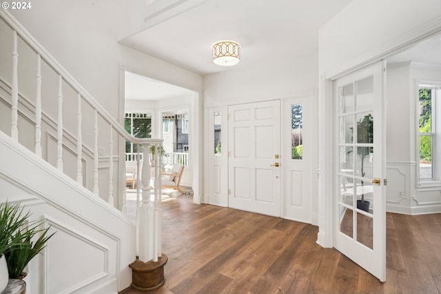 foyer with dark hardwood / wood-style floors